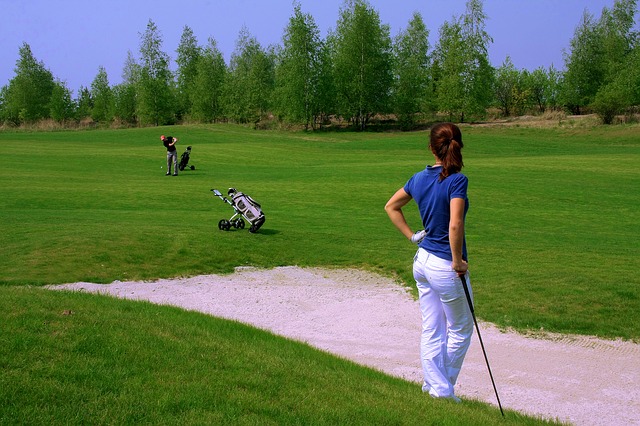 Couple playing golf Couple playing golf