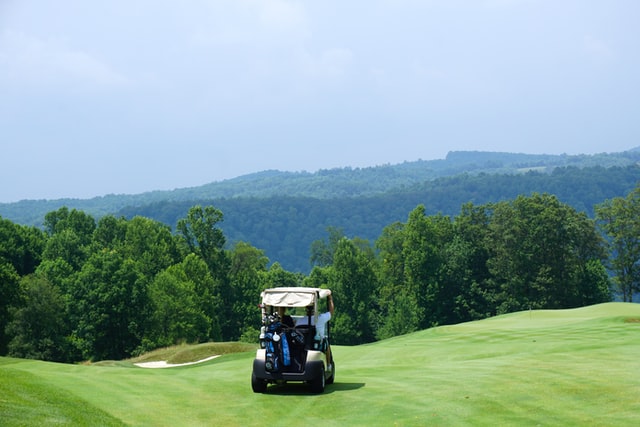 Golf cart on beautiful golf course