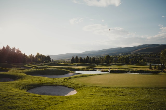 Golf course in the fall by the mountains