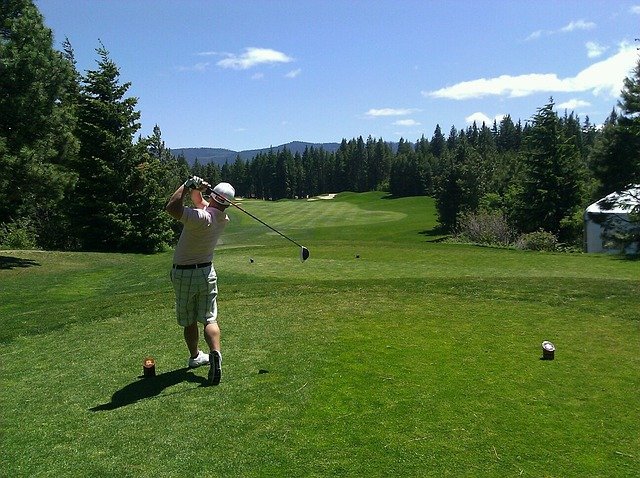 Male playing golf Male playing golf