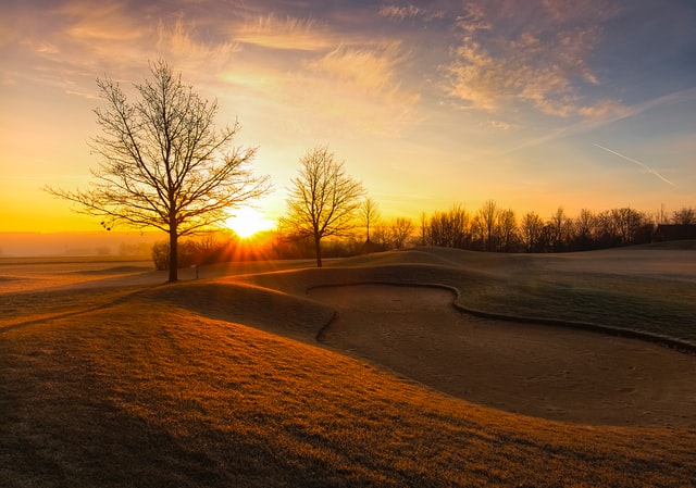 Sunrise over golf course in the fall